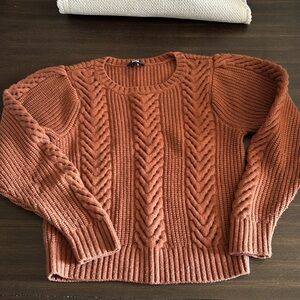 Size small in brand new condition beautifully rust color